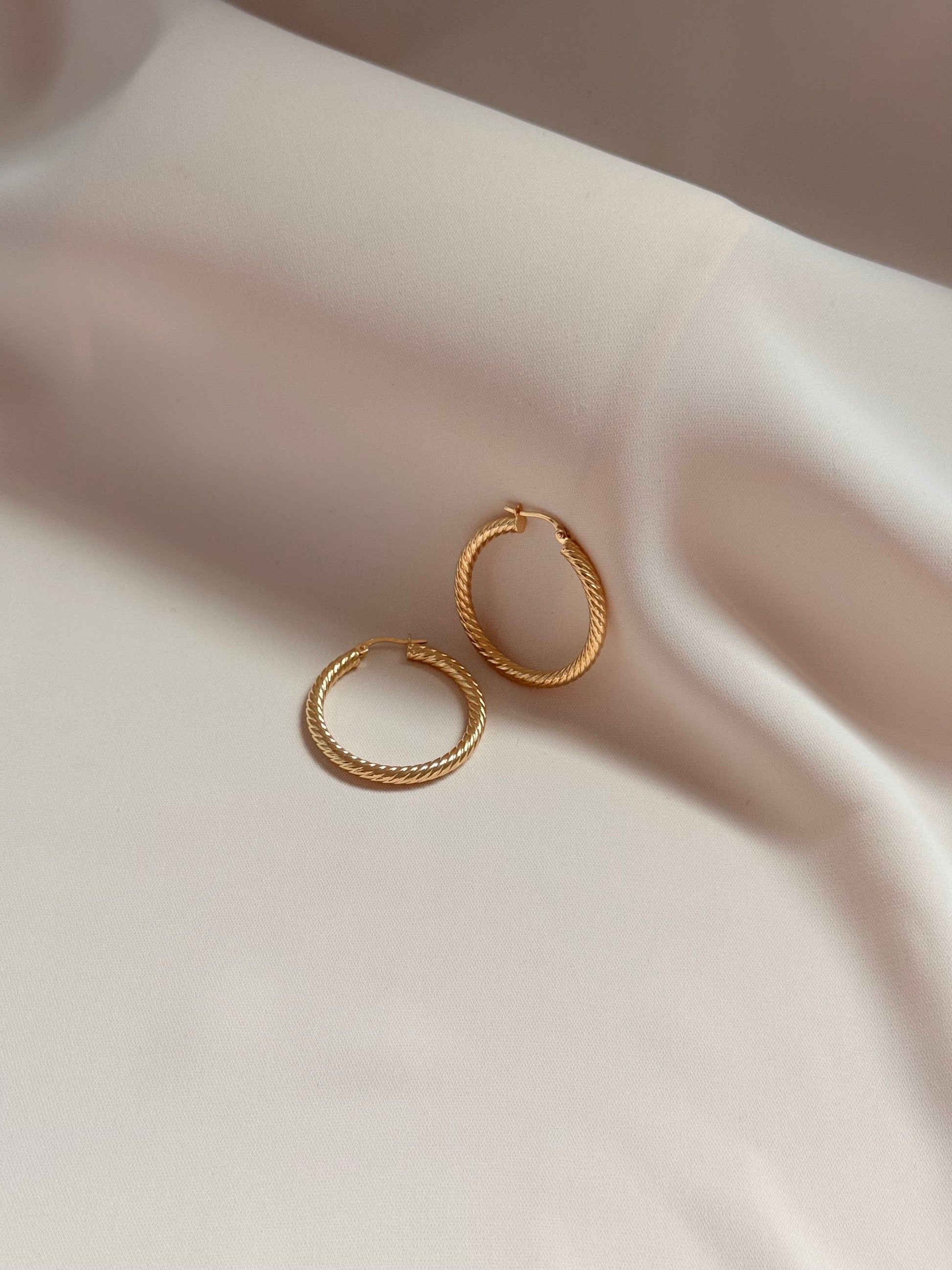 Twisted huggies Earrings 14K